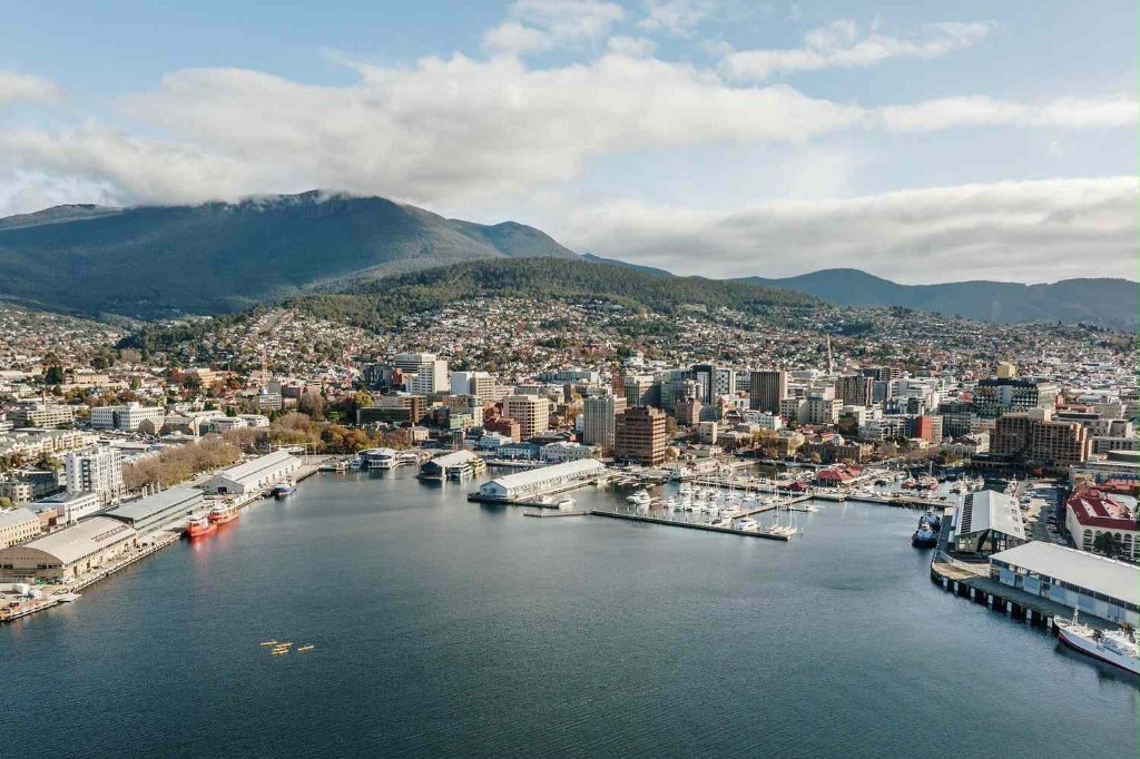 Aerial view of Hobart waterfront and city with kunanyi / Mount Wellington behind