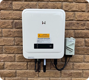 GoodWe inverter mounted on a brick wall
