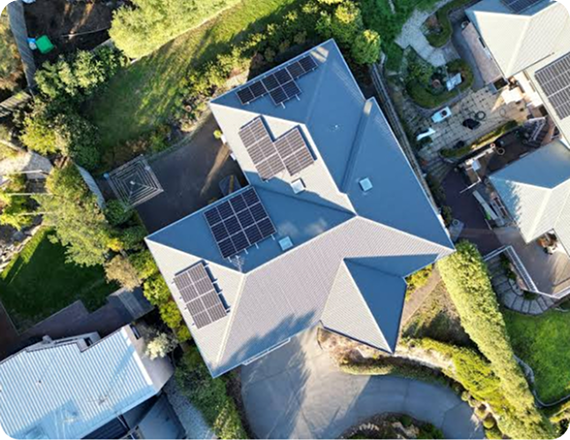 Aerial view of a Southern Tasmanian home with rooftop solar panels